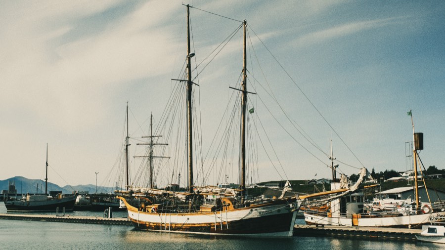 Sailing ships moored in a northern harbor