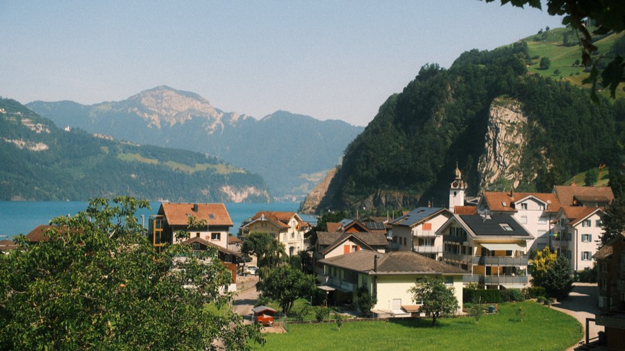 Lakeside village beneath cliffs on Lake Lucerne